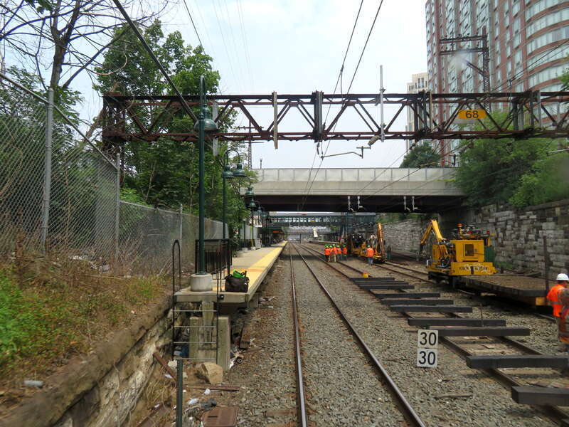 The south end of New Rochelle station viewed from the rear of a Grand Central-bound New Haven Line train in July 2019. Track work was under way on the center tracks.