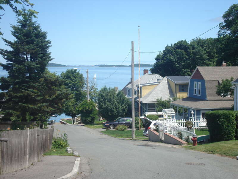 Looking east toward Boston Harbor down a neighborhood street in Squantum, Quincy, Massachusetts.