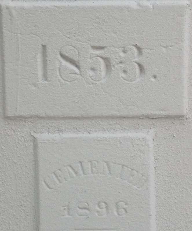 Two cornerstones on St. Joseph Cathedral in Baton Rouge, Louisiana.  The top one is the original cornerstone of the church (1853) and the bottom one the dated the church was cemented (1896).  The church is listed on the National Register of Historic