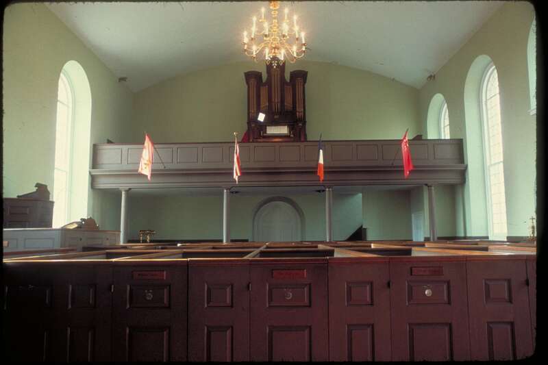 Interior view of confessionals and choir loft in the Church.
This 18th-century church is one of New York's oldest parishes (1665-1980). It was used as a hospital following the important Revolutionary War Battle at Pell's Point in 1776, and was the