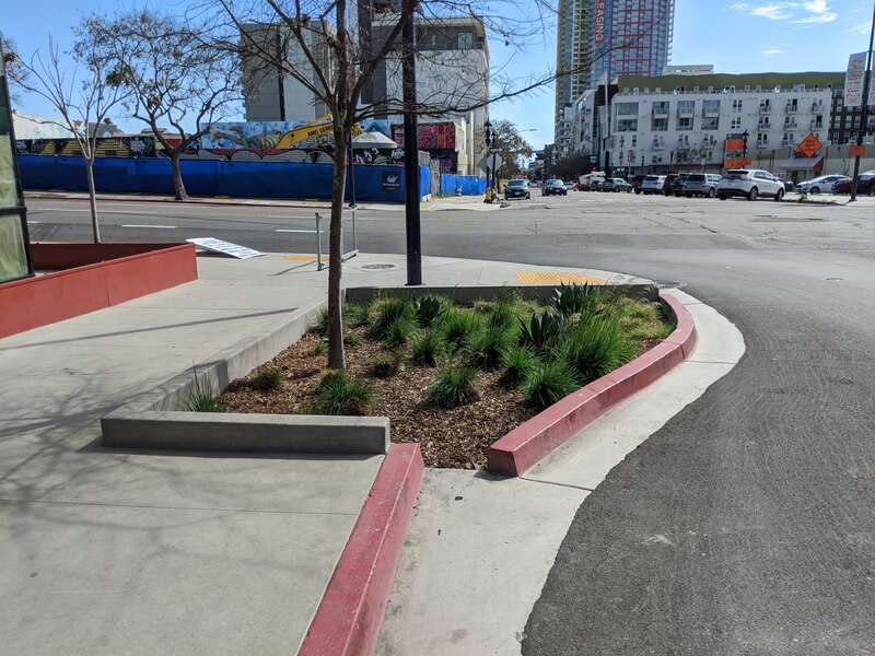Stormwater treatment planter with curb cut in San Diego, CA
