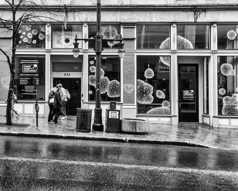 'Space To Ideate' It says on the door.  Desks and working space is available on a month-to-month arrangement for people who need temporary space to work in in down town Portland, ME.  Converted with Silver Efex Pro.