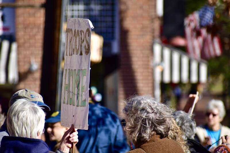 Over 50 people gather at Peace and Justice Plaza across the street from UNC-Chapel Hill to protest actions that might lead to a war with Iran.