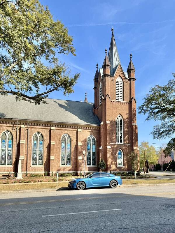 Built in 1872-1875, this Gothic Revival-style building was constructed for the congregation of Washington Street United Methodist Church.  The building features a red brick exterior, front-gable roof, gothic arched bays with stained glass windows and