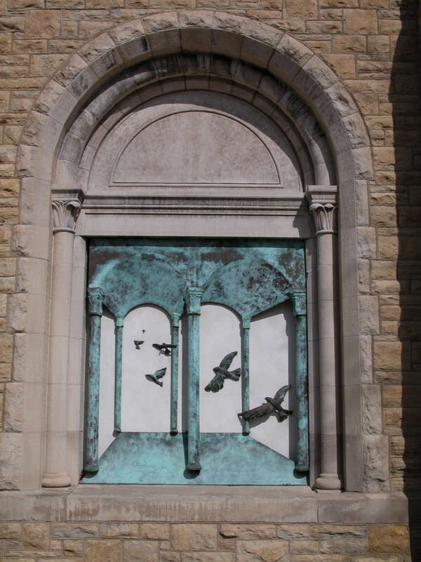 This site specific sculpture portrays birds or spirits flying into the church.