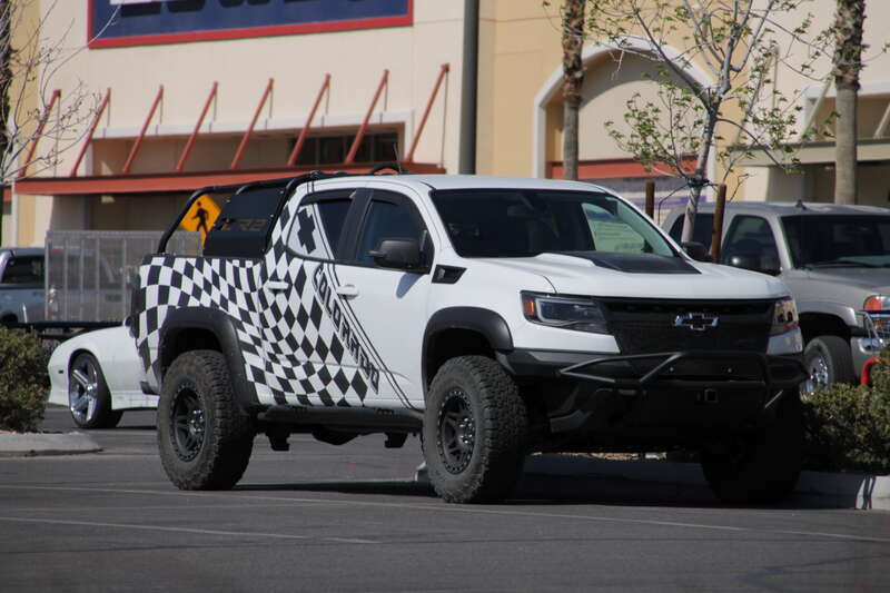 A white and black checkered 2017-20 Chevrolet Colorado ZR2 parked in a Lowe's parking lot along North Jones Boulevard, Las Vegas Nevada.