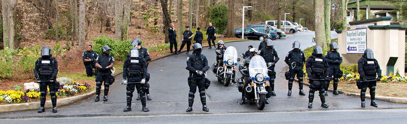 Line of police in riot gear at anti-Scientology protest in Atlanta, GA
