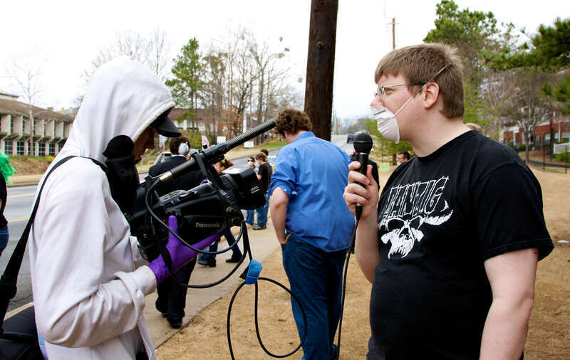 Protester talking to reporter