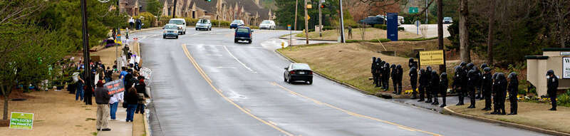 Police and protesters at anti-Scientology protest in Atlanta, GA
