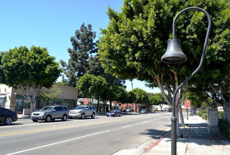 One of several El Camino Real bells along El Camino Real in Old Town Tustin. This one is on the north corner of El Camino Real and Newport Avenue. To the photographer's right is Tustin Community Bank (not seen in this photo).