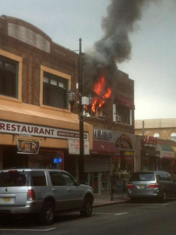 A fire at 4114 Bergenline Avenue in Union City, New Jersey on August 15, 2012. The fire started a short time before 12:45pm, when police officers first arrived on the scene, which was when I was passing by in a commuter van, and first saw what was