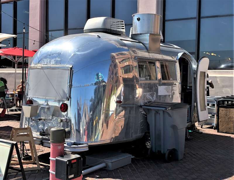 An Airstream Safari being used as a mobile kitchen for a restaurant in the waterfront area of Old Town Alexandria, Virginia.