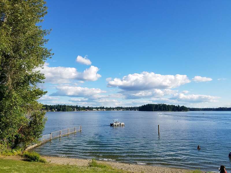 American Lake on a warm June day in Pierce County, Washington, USA, as viewed from the American Lake north park.
