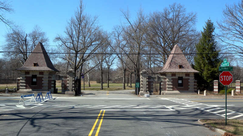 Looking northwest down Ballantine Parkway at Branch Brook Park gate on a sunny midday.