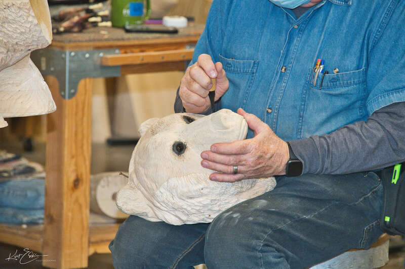 Just huggable bear head being carved on by a seasoned carver at the Albany Historic Carousel  &amp;amp; Museum in downtown Albany, Oregon.