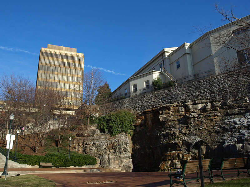 View of the Madison County Courthouse (left) and the First National Bank Building from Big Spring Park in Huntsville, Alabama.