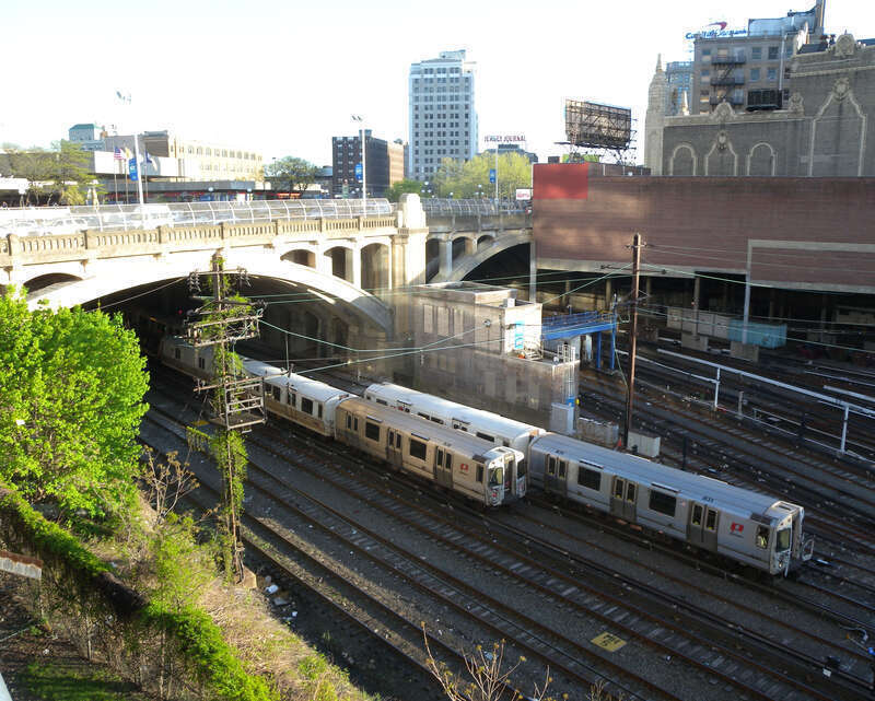 Looking down and southeast at Hudson County Boulevard Bridge in Jersey City, New Jersey on a sunny late afternoon. Loews Jersey Theater in background right.  See File:Blvd Bridge west piers jeh.jpg for closeup of pier.