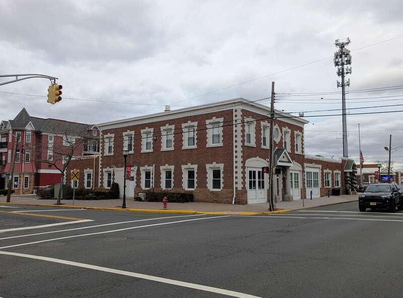 Photo of the Bradley Beach, New Jersey municipal building. Photo taken from the intersection of New Jersey Route 71 (Main Street) and 8th Avenue / LaReine Avenue looking northwest.