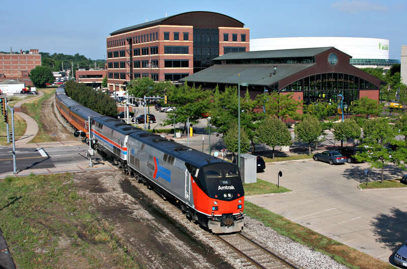 The &quot;Chicago Express&quot; with two Amtrak heritage units rolls by the John Deere Pavilion in Moline, Ill.  Ph 1 156 and Ph II 66 led the train from Rock Island to Chicago at the end of Train Festival 2011.