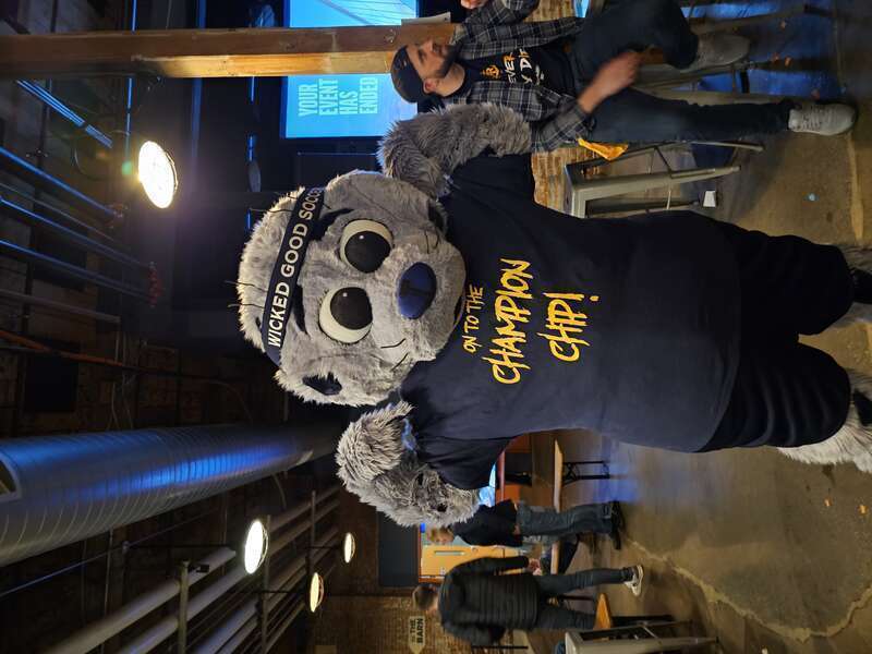 Rhode Island FC mascot Chip wearing a shirt saying &quot;On to the Champion Chip&quot;