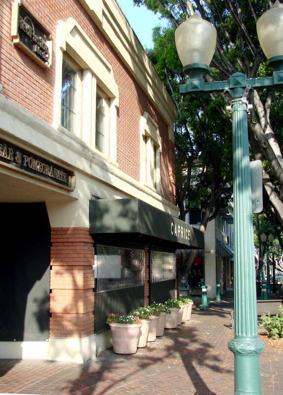 (1 in a multiple picture set)
The south side of State St. in Redlands, CA looking west from in front of 1st California Bank. Note the street lights.