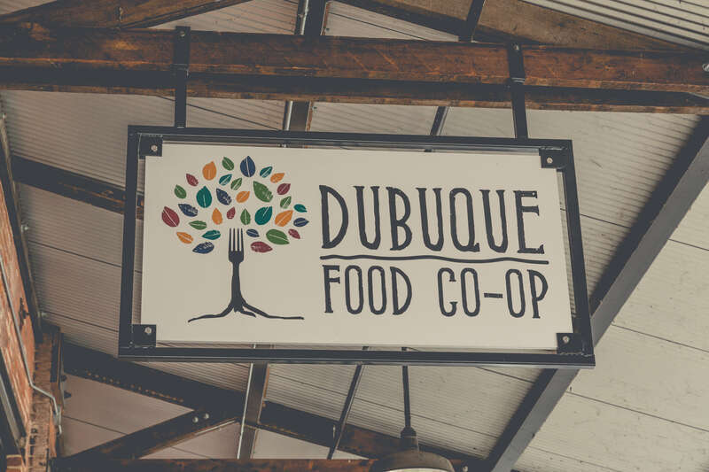 A sign for the Dubuque Food Co-op at 955 Washington Street in the Historic Millwork District of Dubuque, Iowa.