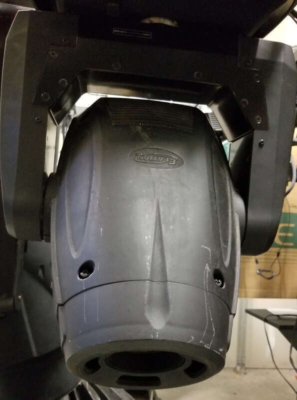 Elation Platinum Spot 5R Pro hanging from a storage rack.