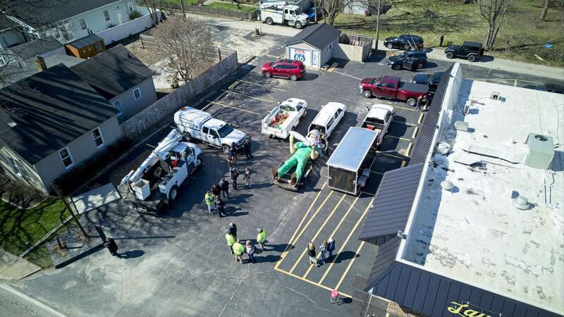 The Gemini Giant loaded onto a trailer after being sold at auction.
