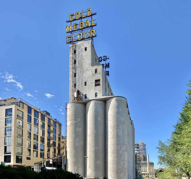 Built in 1908 by the Haglin-Stahr Company, this 185-foot-tall concrete structure was added to the adjacent Washburn, Crosby and Company A Flour Mill to increase production.  The structure consists of 15 cylindrical concrete bins with a 5-story