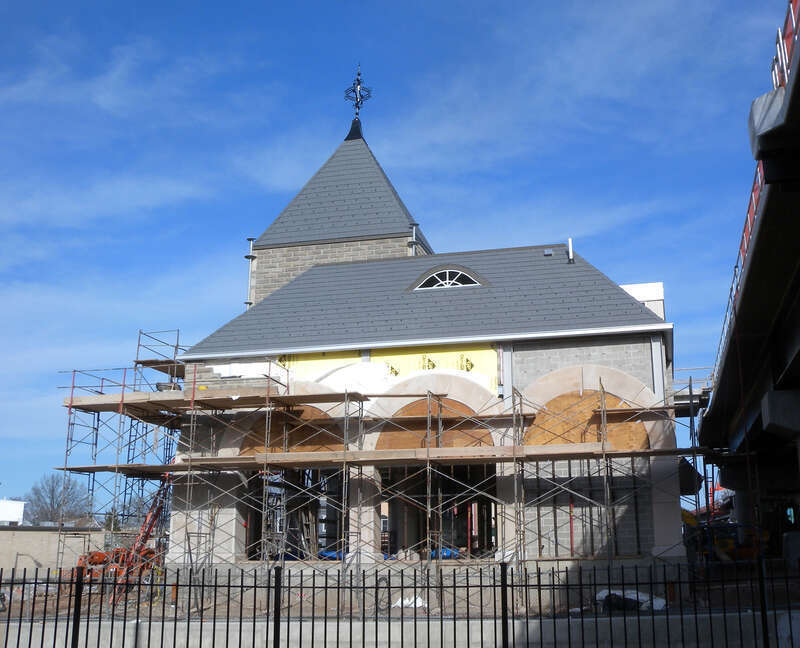 Looking east across Avenue C at 8th Street trolley station under construction on a sunny early afternoon.  See also File:HBLR 8 St front const jeh.JPG for front view.