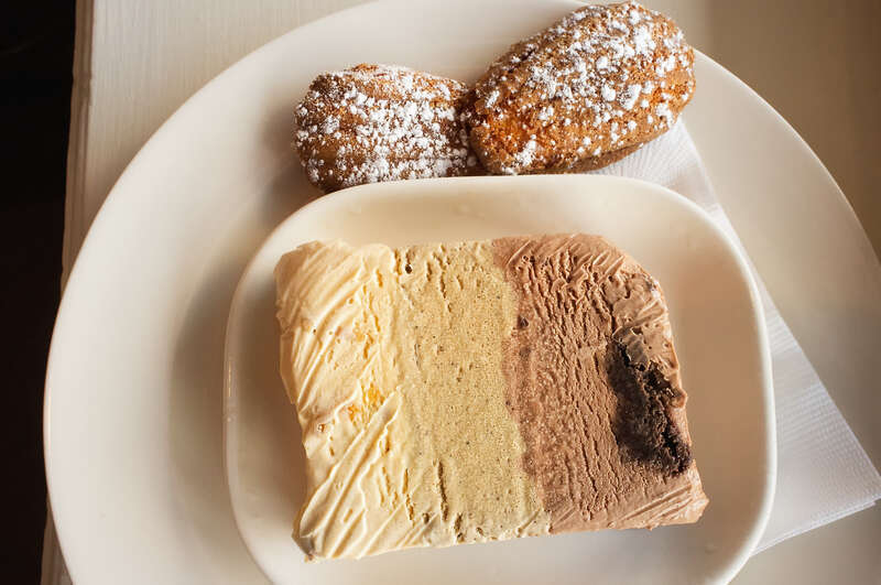 At Ollie Irene in  Mountain Brook, Alabama, we had for dessert the Triple Decker Ice Cream Terrine -  - left layer 1) orange-caramel-toasted pine nut ice cream; middle layer 2) Vietnamese coffee-Makers Mark ice cream; right layer 3)