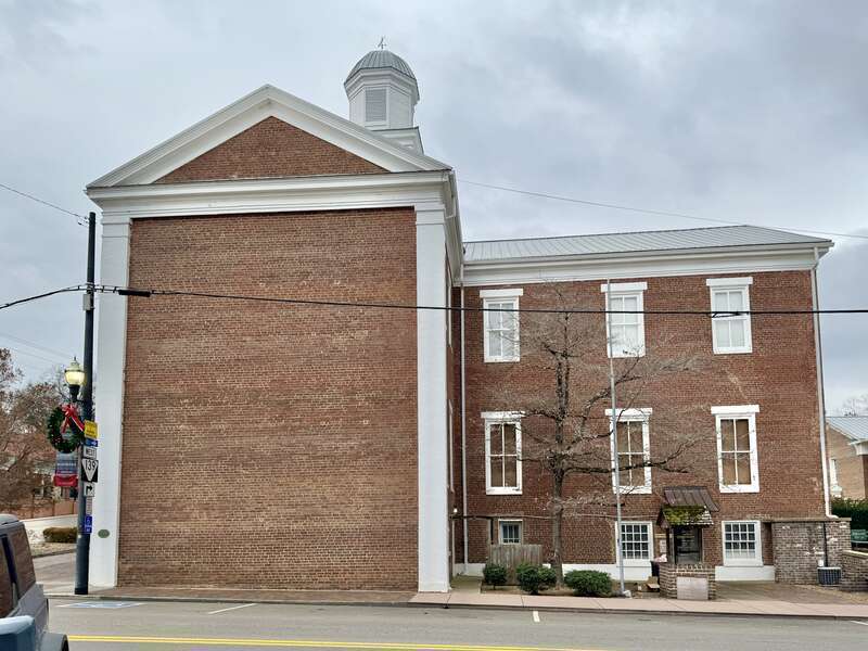 Built in 1845-1846, this Greek Revival-style building was designed by Judge Robert Hynes and built by the Hickman Brothers to serve as the Jefferson County Courthouse, and replaced a previous courthouse built in 1794.  The building features a red