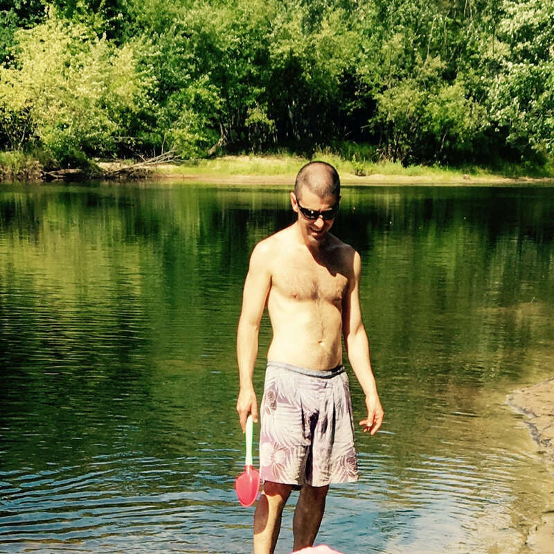 Kimball Pond in Hopkinton, NH.  Resident Aaron Sommers on the shore of the pond.