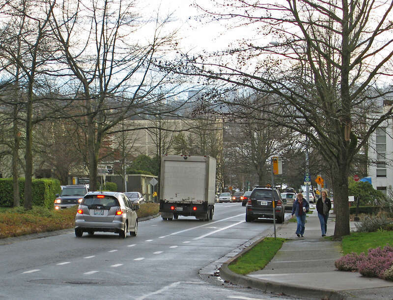 a bus stop, bike lane and sidewalk illustrate a &quot;complete street&quot; in Kirkland that serves all users.
This work is licensed under a
Creative Commons Attribution 3.0 United States License.

Please Attribute to: Brett VA