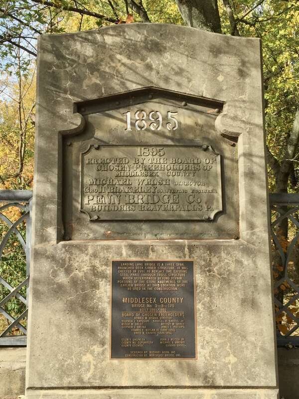 Historical information about the Landing Lane Bridge in Piscataway, New Jersey. The monument incorporates the bridge nameplate from 1895.