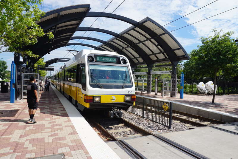 A DART Light Rail Green Line train at MLK Jr. Station in the South Dallas neighborhood in Dallas, Texas (United States).