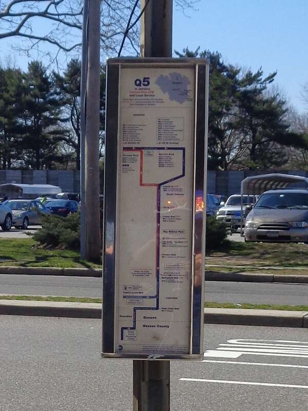 A bus stop sign at Green Acres Mall in Valley Stream, Nassau County. This is a stop for the n1, n2, and n8 routes of the Nassau Inter-County Express of Nassau County, as well as the outbound (Jamaica, Queens-bound) stop for the Q5 and Q85 of the MTA.