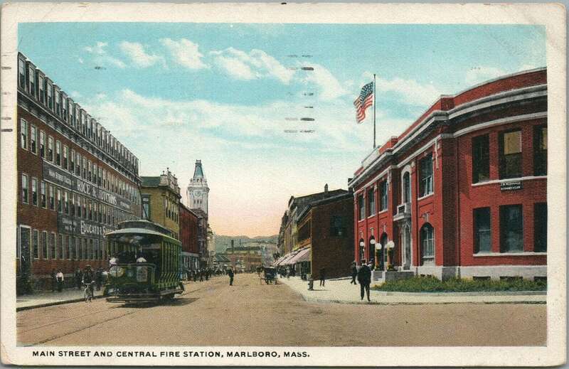 White border postcard of Main Street in Marlborough, Massachusetts, postmarked 1923. At right is the Central Fire Station; at left is a Boston and Worcester Street Railway streetcar.