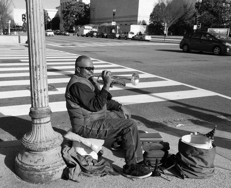 A cornetist plays in the Federal Triangle, Washington, D.C.