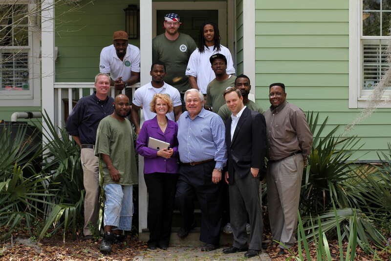 North Charleston Mayor R. Keith Summey visits with the Sustainability Institute's Energy Conservation Corps at their Green House on East Montague.

Photo by Ryan Johnson