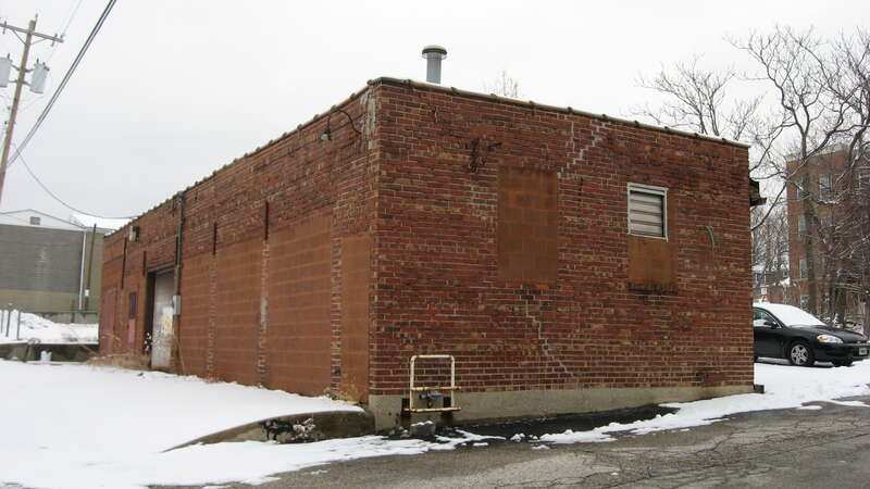Rear and southern side of the commercial building located at 613 N. Morton Street in Bloomington, Indiana, United States.  Built in 1920, it is a part of the Bloomington West Side Historic District, a historic district that is listed on the National