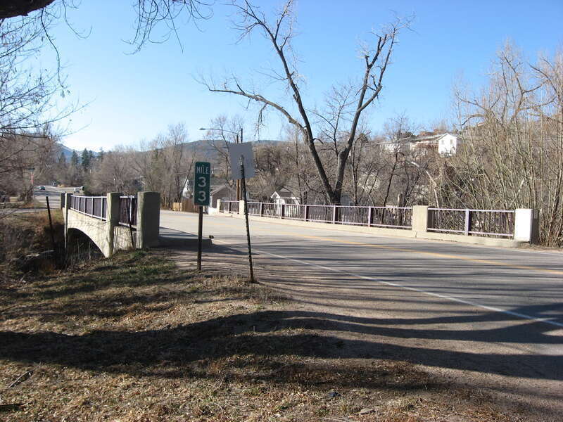 Northern end and eastern side of the North St. Vrain Creek Bridge in southern Lyons, Colorado, United States, which carries State Highway 7 over the North St. Vrain Creek.  Built in 1955, the bridge is listed on the National Register of Historic
