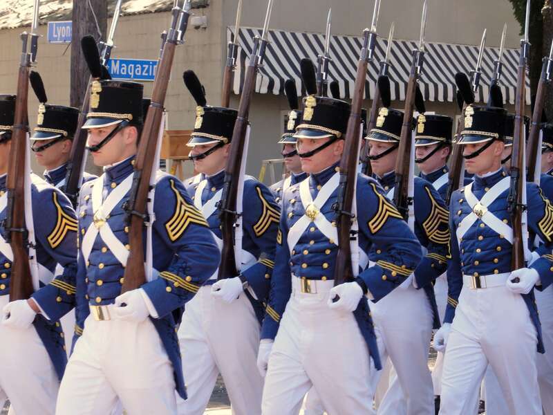 Day time Carnival parade on Magazine Street, Uptown New Orleans

I remember when chin straps used to be deployed in the general vicinity of the chin. Often they'd be a little too short to reach the chin itself, giving an appearance of military