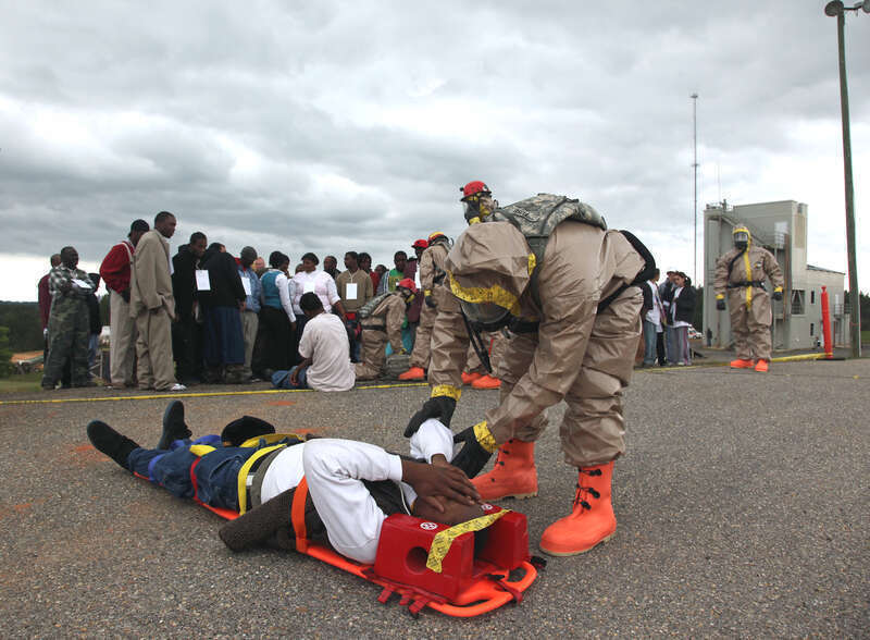 Soldiers of Douglas’ 848th Engineer Company, the search and extraction element of Georgia’s Joint Task Force 781 and CBRNE Enhanced Response Force Package (CERFP), see to the needs of an “earthquake victim,” while other “victims” line up for the walk