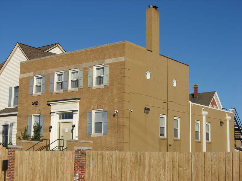 Front and southern side of the Peacock Apartments, located at 414 S. Jefferson Street in Muncie, Indiana, United States.  Built in 1907, it is listed on the National Register of Historic Places.