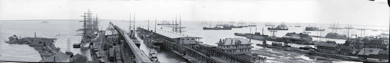 View of Pensacola Harbor about 1905. In the distance is parts of the US Navy fleet including one of the Indiana Class Battleships, a Kearsarge Class Battleship (it almost has to be the USS Kearsarge, she spent several years at Pensacola ) and a