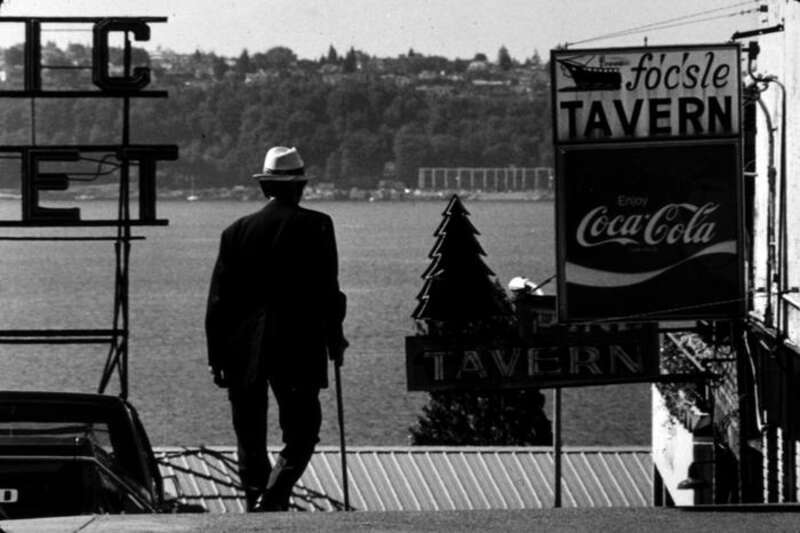 Man walking down Pine Street, Pike Place Market, Seattle, Washington state, U.S., 1981.