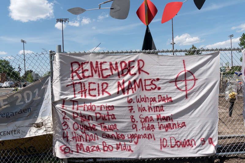 Remember Their names, a sign on the perimeter fence around the Walker's sculpture garden that lists the Native American's executed on December 26. 1862.
Photograph by Lorie Shaull.
&quot;Scaffold,&quot; a wood &amp;amp; steel sculpture by the artist Sam Durant,