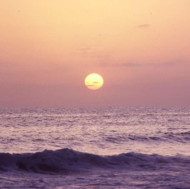 (1 in a multiple picture set)
The sun is about to go down, the waves are rolling gently onto the sand, and no one else is around. The sky turns a beautiful gold color and the photographer thanks God he is there to capture the scene.
