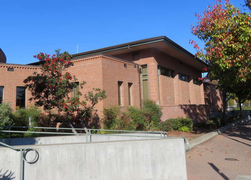 A side building (used for luggage carts and the Chamber of Commerce offices) at Martinez station in November 2019